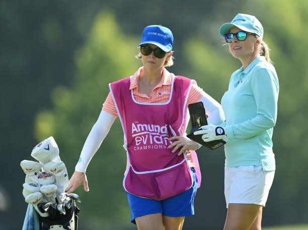 Sarah Kemp of Australia looks on with their caddie on the 7th hole during day two of the The Amundi Evian Championship at Evian Resort Golf Club on...
