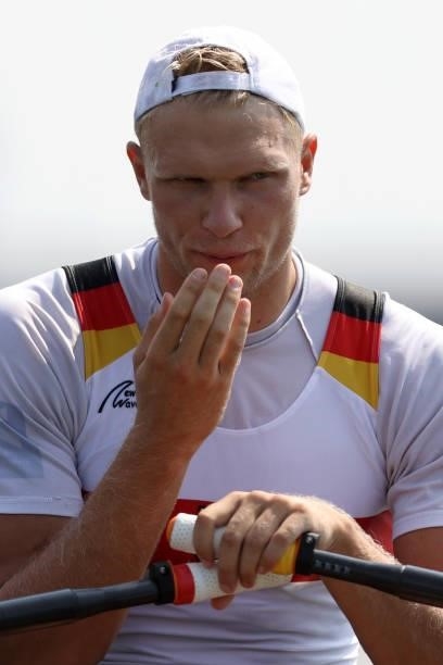 Oliver Zeidler of Team Germany blows his fingers at the start line ahead of the Men’s Single Sculls Heat 6 during the Tokyo 2020 Olympic Games at Sea...