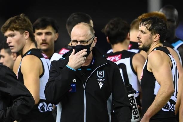 Power head coach Ken Hinkley walks away from talking to his players during the round 19 AFL match between Port Adelaide Power and Collingwood Magpies...