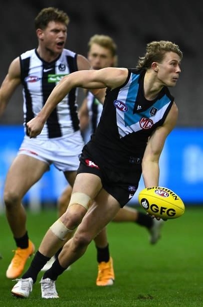 Xavier Duursma of the Power handballs during the round 19 AFL match between Port Adelaide Power and Collingwood Magpies at Marvel Stadium on July 23,...
