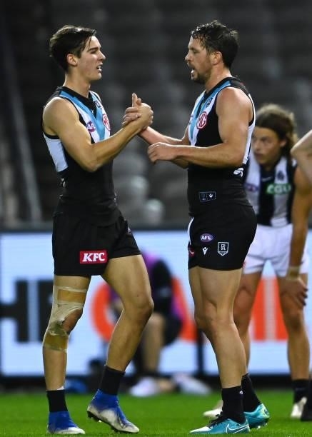 Travis Boak of the Power is congratulated by Connor Rozee of the Power after winning the round 19 AFL match between Port Adelaide Power and...