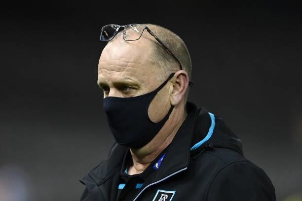 Power head coach Ken Hinkley walks away from talking to his players during the round 19 AFL match between Port Adelaide Power and Collingwood Magpies...