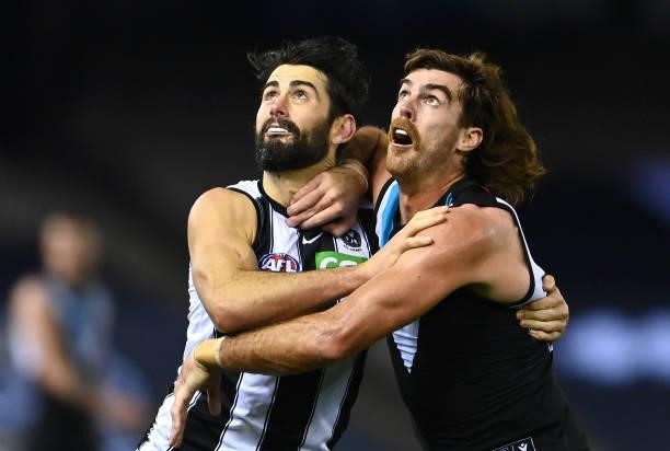 Brodie Grundy of the Magpies and Scott Lycett of the Power compete in the ruck during the round 19 AFL match between Port Adelaide Power and...
