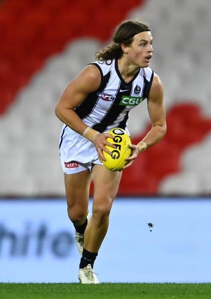 Jack Ginnivan of the Magpies looks to pass the ball during the round 19 AFL match between Port Adelaide Power and Collingwood Magpies at Marvel...