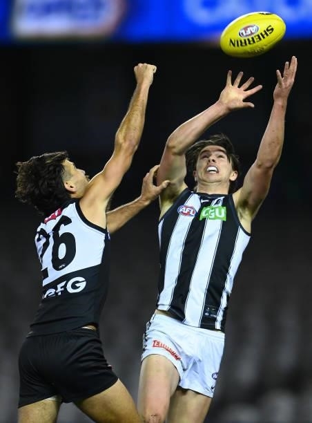 Oliver Henry of the Magpies marks infront of Riley Bonner of the Power during the round 19 AFL match between Port Adelaide Power and Collingwood...