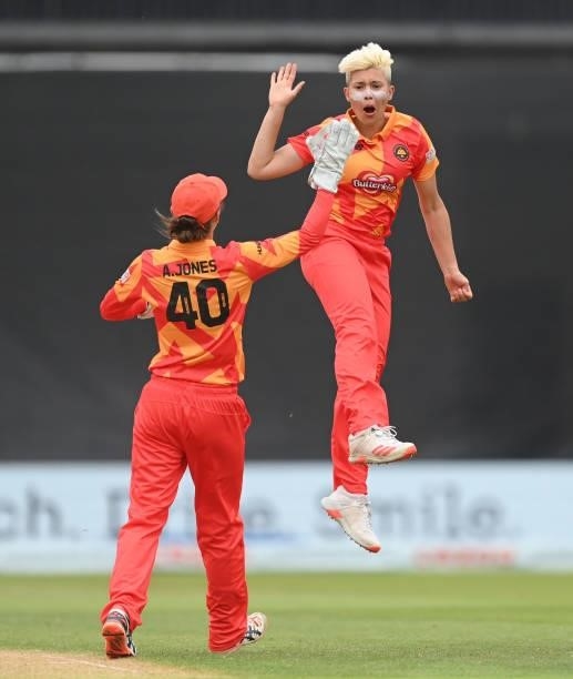 Issy Wong of Birmingham Pheonix celebrates with Amy Jones after dismissing Deandra Dottin of London Spirit during The Hundred match between...