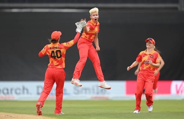Issy Wong of Birmingham Pheonix celebrates with Amy Jones after dismissing Deandra Dottin of London Spirit during The Hundred match between...