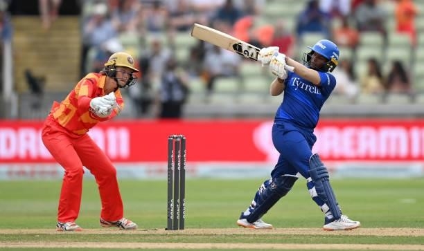 Deepti Sharma of London Spirit bats watched by Birmingham Phoenix wicketkeeper Amy Jones during The Hundred match between Birmingham Phoenix and...