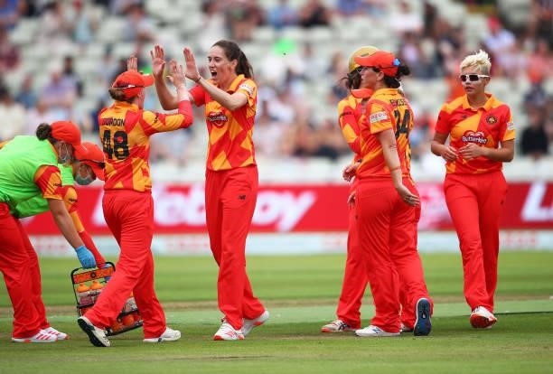 Emily Arlott of Birmingham Phoenix celebrates with her teammates after dismissing Chloe Tryon of London Spirit during The Hundred game between...