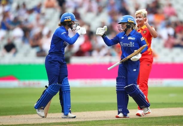 Charlie Dean and Amara Carr of London Spirit punch gloves during The Hundred game between Birmingham Phoenix and London Spirit at Edgbaston on July...
