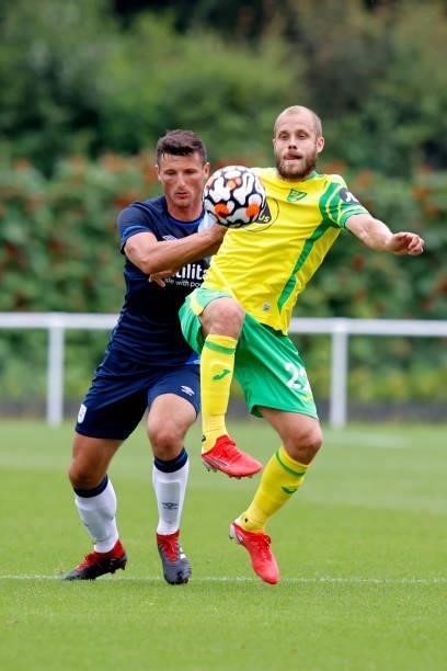 Matty Pearson of Huddersfield Town battles with Teemu Pukki of Norwich City during the game between Norwich City and Huddersfield Town on July 23,...