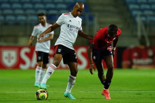 Joao Mario of SL Benfica battles for possession with Tiago Djalo of LOSC Lille during the Pre-Season Friendly match between SL Benfica and Lille at...
