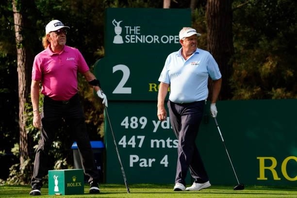 Miguel Angel Jimenez of Spain and Colin Montgomerie of Scotland in action during the second round of the Senior Open presented by Rolex at...