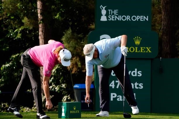 Miguel Angel Jimenez of Spain and Colin Montgomerie of Scotland in action during the second round of the Senior Open presented by Rolex at...