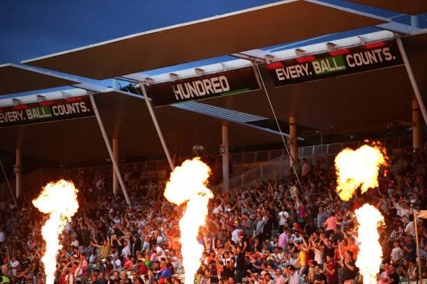 Flames go up as spectators watch on during The Hundred game between Birmingham Phoenix and London Spirit at Edgbaston on July 23, 2021 in Birmingham,...