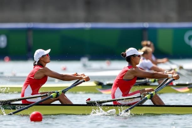 Shuangmei Shen and Xiaoxin Liu of Team China compete during the Women's Double Sculls Repechage 1 on day one of the Tokyo 2020 Olympic Games at Sea...
