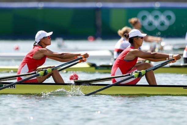 Shuangmei Shen and Xiaoxin Liu of Team China compete during the Women's Double Sculls Repechage 1 on day one of the Tokyo 2020 Olympic Games at Sea...