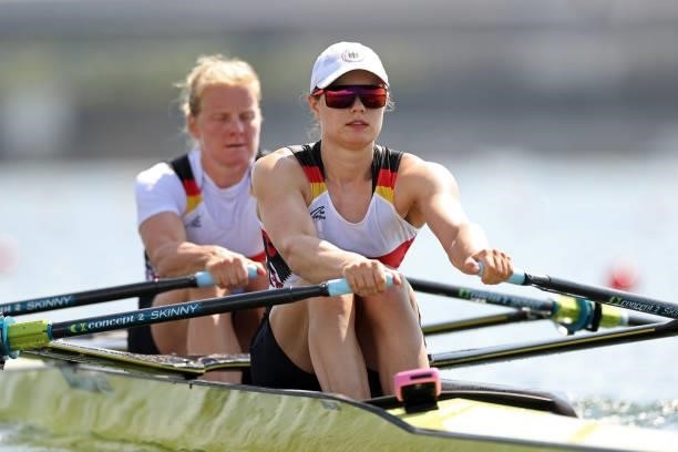 Annekatrin Thiele and Leonie Menzel of Team Germany compete during the Women's Double Sculls Repechage 1 on day one of the Tokyo 2020 Olympic Games...