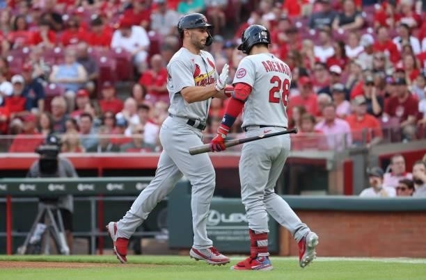 Paul Goldschmidt of the St. Louis Cardinals celebrates with Nolan Arenado after hitting a home run against the Cincinnati Reds in the first inning at...