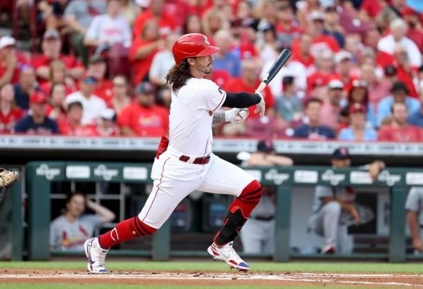 Jonathan India of the Cincinnati Reds hits a single in the first inning against the St. Louis Cardinals at Great American Ball Park on July 23, 2021...