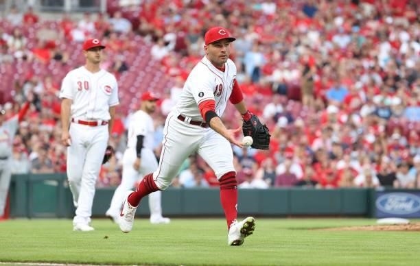 Joey Votto of the Cincinnati Reds throws the ball to first base against the St. Louis Cardinals at Great American Ball Park on July 23, 2021 in...