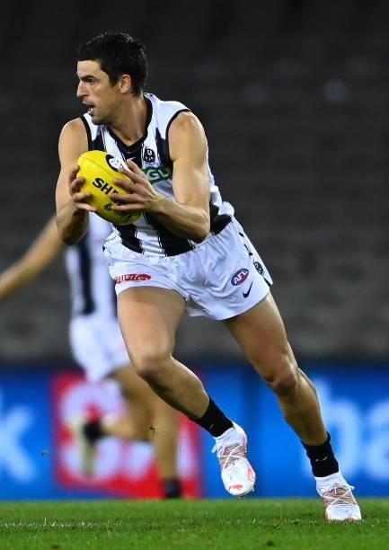 Scott Pendlebury of the Magpies looks to pass the ball during the round 19 AFL match between Port Adelaide Power and Collingwood Magpies at Marvel...