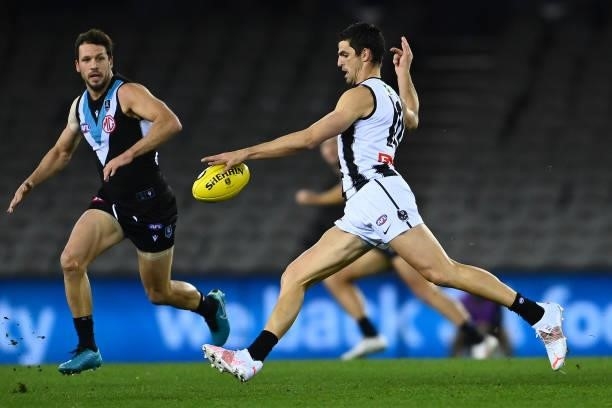 Scott Pendlebury of the Magpies kicks during the round 19 AFL match between Port Adelaide Power and Collingwood Magpies at Marvel Stadium on July 23,...