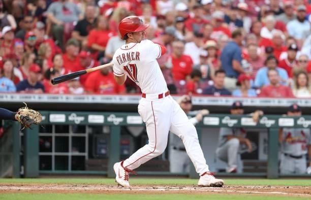 Kyler Farmer of the Cincinnati Reds hits a single in the second inning against the St. Louis Cardinals at Great American Ball Park on July 23, 2021...