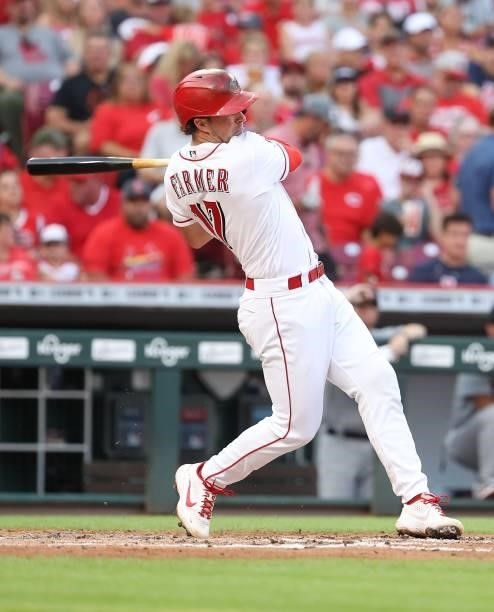 Kyler Farmer of the Cincinnati Reds hits a single in the second inning against the St. Louis Cardinals at Great American Ball Park on July 23, 2021...