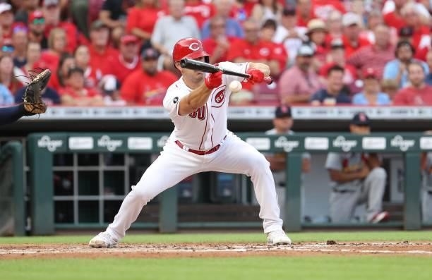 Tyler Mahle of the Cincinnati Reds hits a sacrifice bunt in the second inning against the St. Louis Cardinals at Great American Ball Park on July 23,...