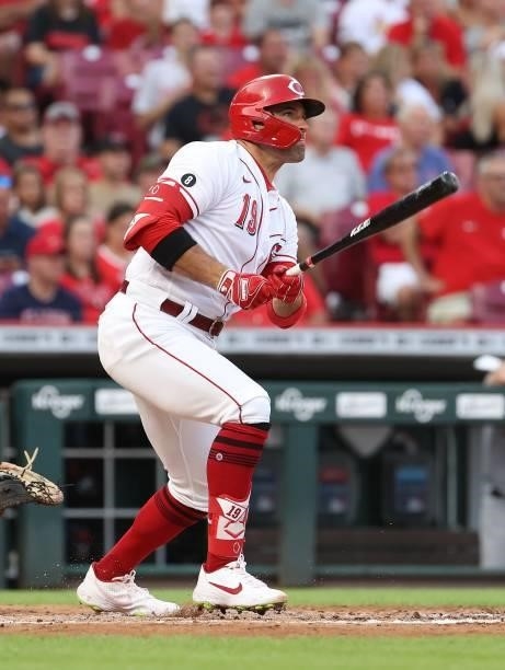 Joey Votto of the Cincinnati Reds hits a single in the third inning against the St. Louis Cardinals at Great American Ball Park on July 23, 2021 in...