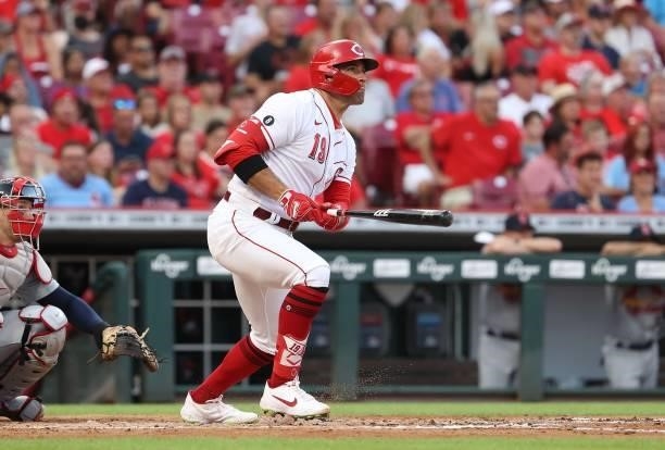 Joey Votto of the Cincinnati Reds hits a single in the third inning against the St. Louis Cardinals at Great American Ball Park on July 23, 2021 in...