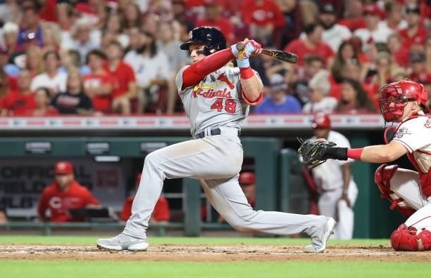 Harrison Bader of the St. Louis Cardinals hits a double against the Cincinnati Reds in the sixth inning at Great American Ball Park on July 23, 2021...