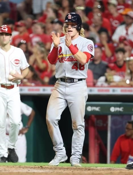 Harrison Bader of the St. Louis Cardinals celebrates after scoring against the Cincinnati Reds in the sixth inning at Great American Ball Park on...