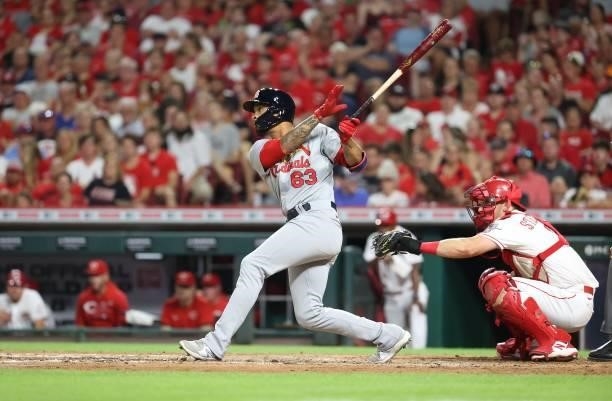 Edmundo Sosa of the St. Louis Cardinals hits a single in the sixth inning against the Cincinnati Reds at Great American Ball Park on July 23, 2021 in...