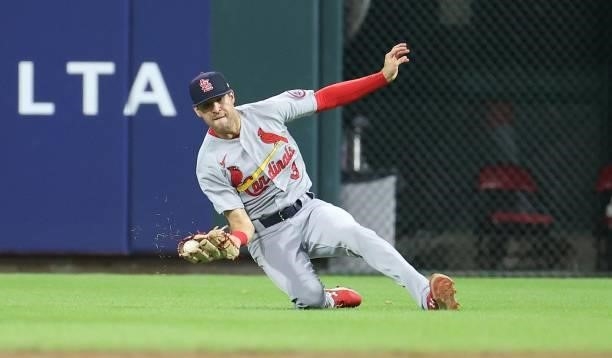 Dylan Carlson of the St. Louis Cardinals makes a diving catch in the sixth inning against the Cincinnati Reds at Great American Ball Park on July 23,...