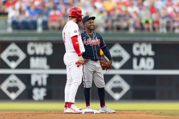 Bryce Harper of the Philadelphia Phillies talks to Ozzie Albies of the Atlanta Braves at Citizens Bank Park on July 23, 2021 in Philadelphia,...