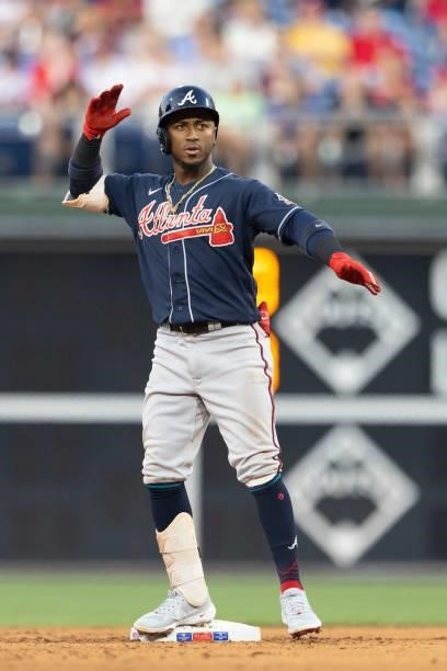 Ozzie Albies of the Atlanta Braves reacts against the Philadelphia Phillies at Citizens Bank Park on July 23, 2021 in Philadelphia, Pennsylvania. The...