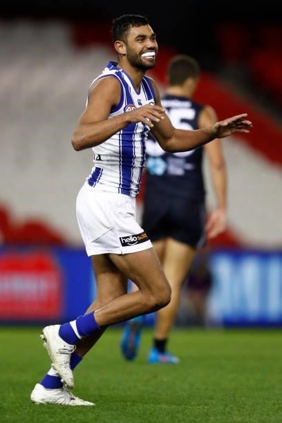Tarryn Thomas of the Kangaroos celebrates a goal during the round 19 AFL match between Carlton Blues and North Melbourne Kangaroos s at Marvel...