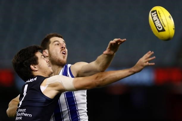 Jack Silvagni of the Blues and Tristan Xerri of the Kangaroos compete during the round 19 AFL match between Carlton Blues and North Melbourne...