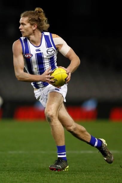 Jed Anderson of the Kangaroos runs with the ball during the round 19 AFL match between Carlton Blues and North Melbourne Kangaroos s at Marvel...