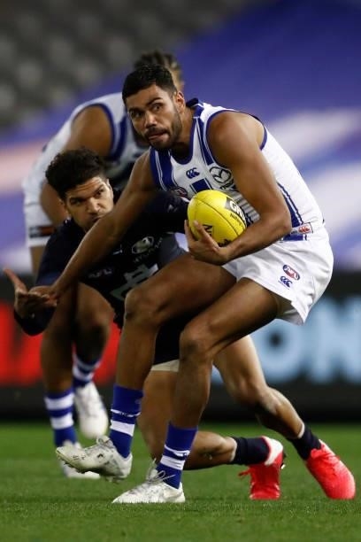 Tarryn Thomas of the Kangaroos gathers the ball during the round 19 AFL match between Carlton Blues and North Melbourne Kangaroos s at Marvel Stadium...