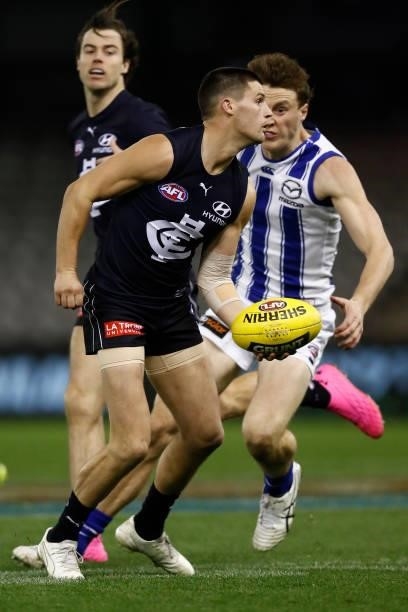 Nic Newman of the Blues handballs during the round 19 AFL match between Carlton Blues and North Melbourne Kangaroos s at Marvel Stadium on July 24,...