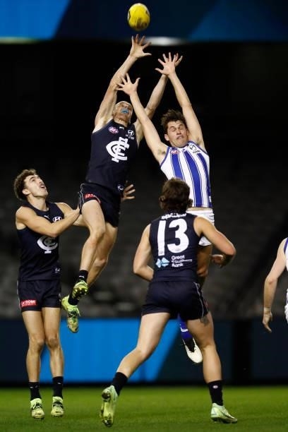 Matthew Cottrell of the Blues jumps for the ball during the round 19 AFL match between Carlton Blues and North Melbourne Kangaroos s at Marvel...