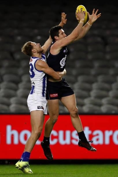 Benjamin McKay of the Kangaroos spoils Jacob Weitering of the Blues during the round 19 AFL match between Carlton Blues and North Melbourne Kangaroos...