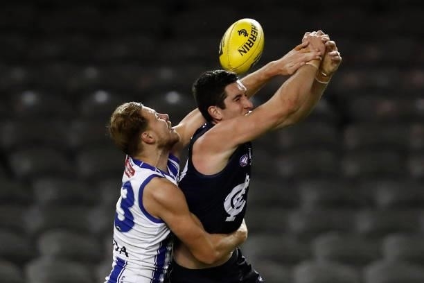 Benjamin McKay of the Kangaroos spoils Jacob Weitering of the Blues during the round 19 AFL match between Carlton Blues and North Melbourne Kangaroos...