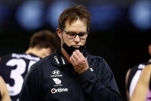 David Teague, senior coach of Carlton walks from the 3/4 time huddle during the round 19 AFL match between Carlton Blues and North Melbourne...