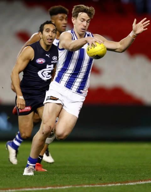Trent Dumont of the Kangaroos runs with the ball during the round 19 AFL match between Carlton Blues and North Melbourne Kangaroos s at Marvel...