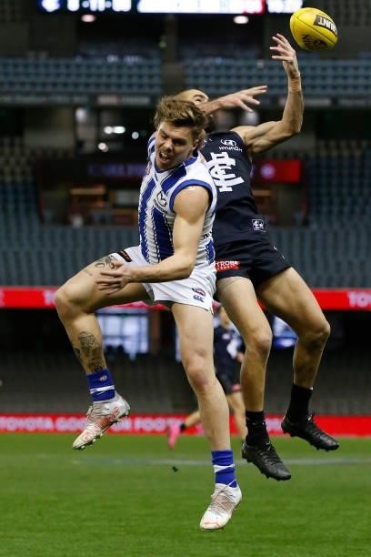 Adam Saad of the Blues and Cameron Zurhaar of the Kangaroos compete during the round 19 AFL match between Carlton Blues and North Melbourne Kangaroos...