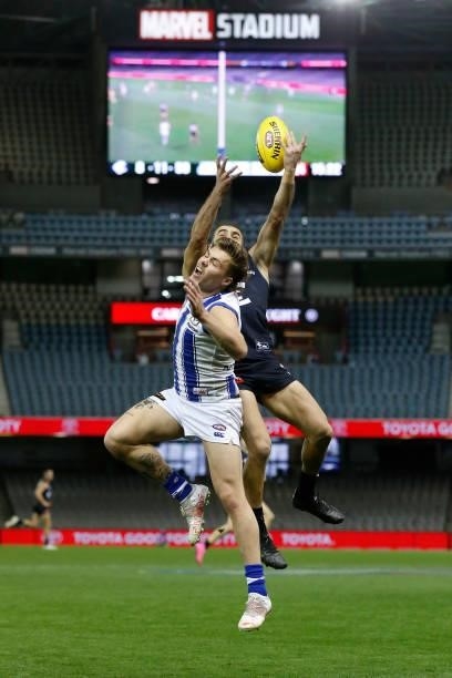 Adam Saad of the Blues and Cameron Zurhaar of the Kangaroos compete during the round 19 AFL match between Carlton Blues and North Melbourne Kangaroos...